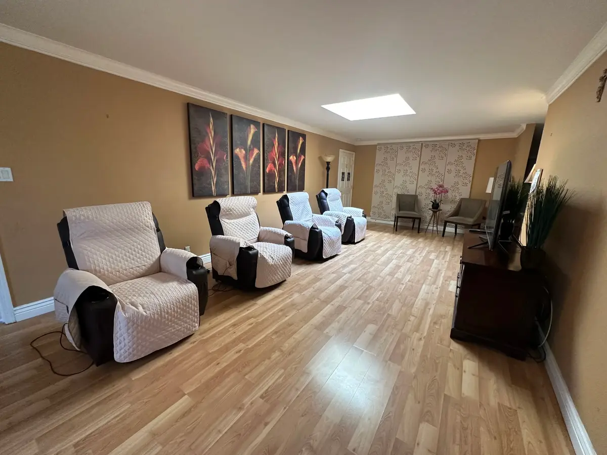 Modern living room with red chair and city view